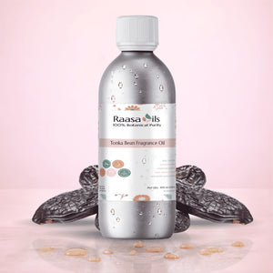 Bottle of Raasa Oils Torka Bean Fragrance Oil with dried fruits on a pink background