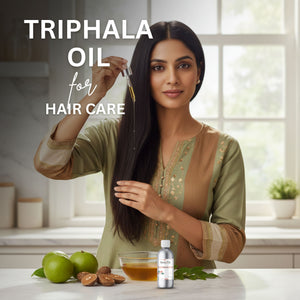 Woman applying Triphala oil to her hair with ingredients on a table.