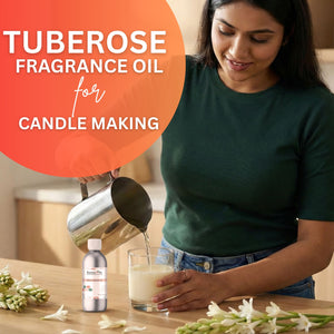 Woman pouring liquid into a glass with Tuberose fragrance oil for candle making, surrounded by tuberose flowers.