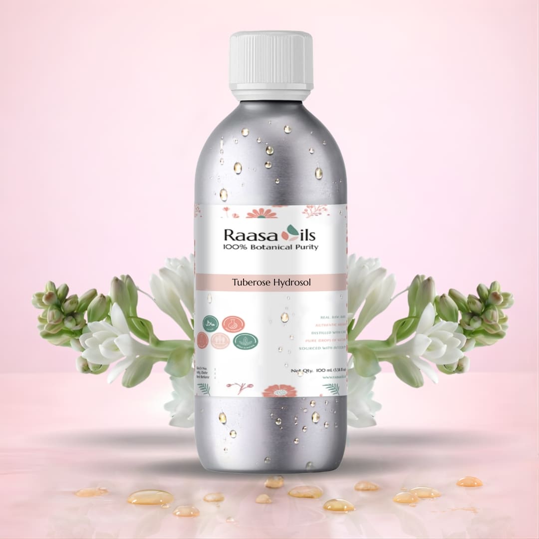 Bottle of Raasa Oils Tuberose Hydrosol with floral elements on a pink background
