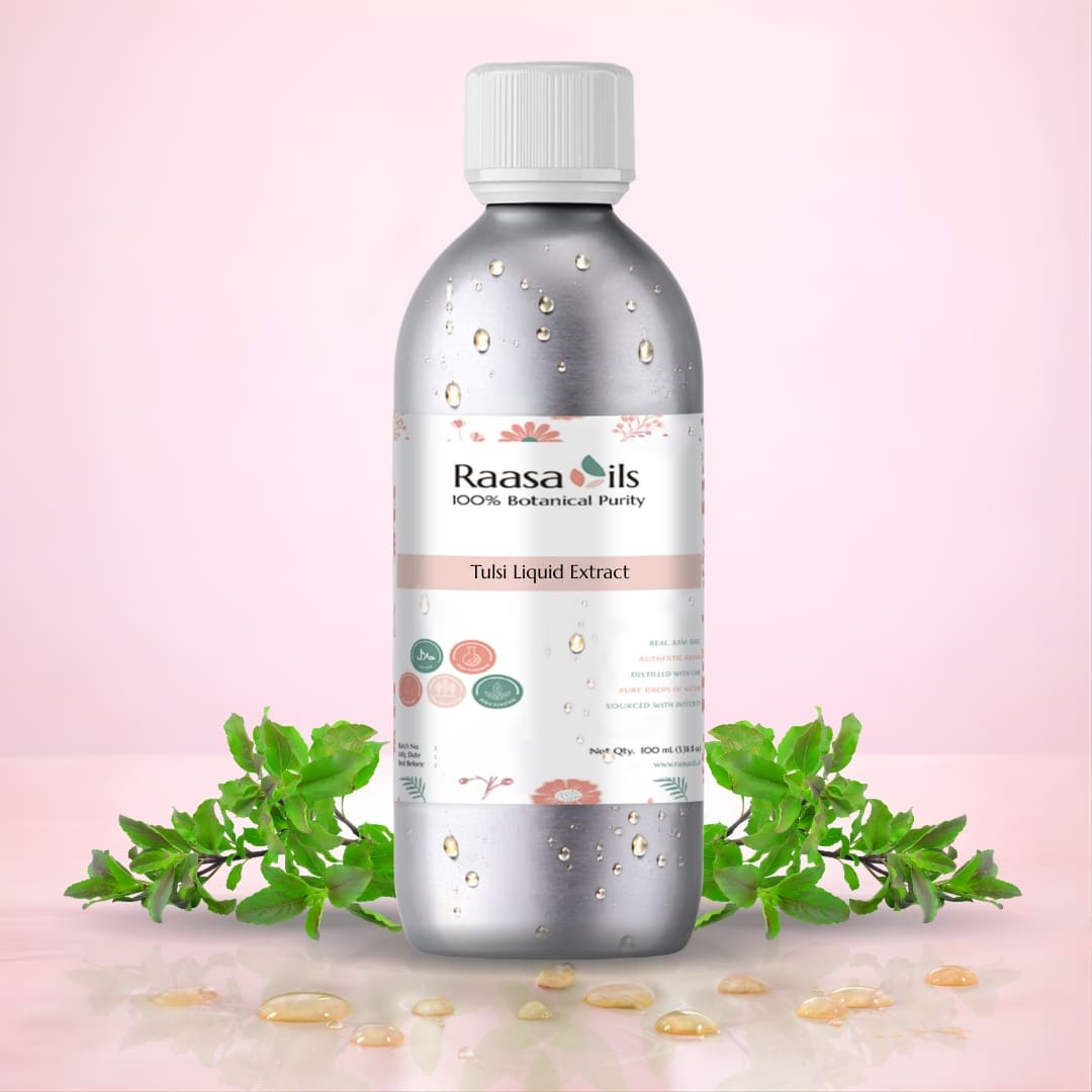 Raasa Oils bottle with green leaves on a pink background
