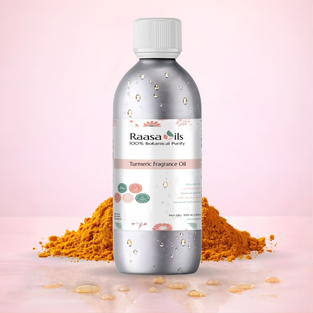 Bottle of Raasa Oils Turmeric Fragrance Oil with turmeric powder on a pink background