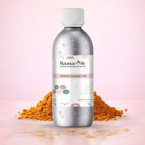 Bottle of Raasa Oils Turmeric Fragrance Oil with turmeric powder on a pink background