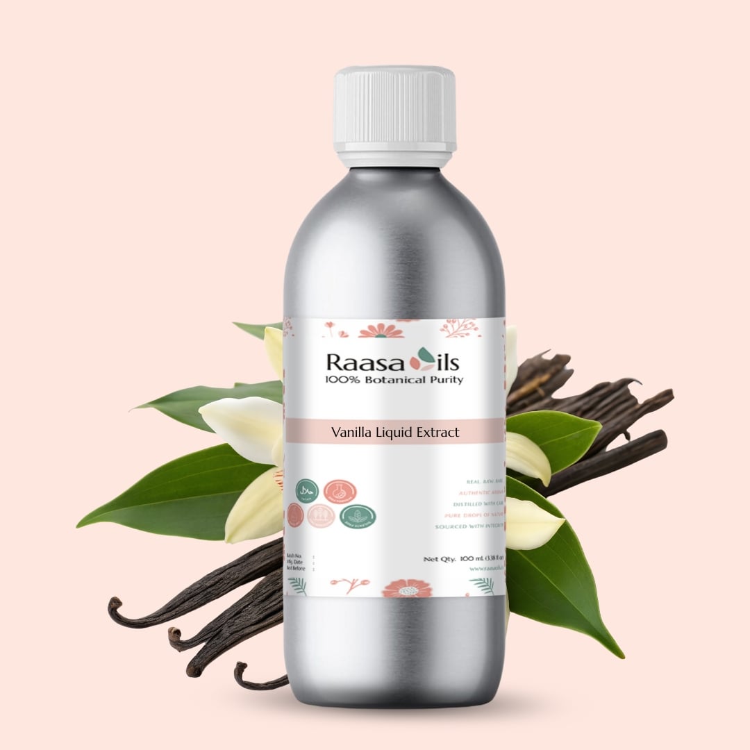 Bottle of Raasa Oils Vanilla Liquid Extract with vanilla beans and leaves on a light pink background