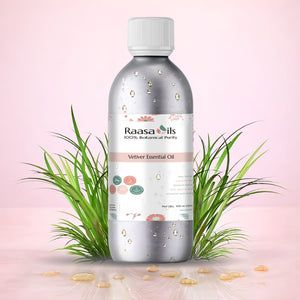 Bottle of Raasa Oils Vetiver Essential Oil with grass on a pink background