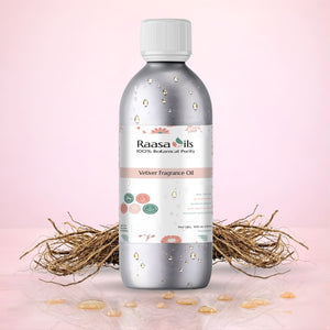 Bottle of Raasa Oils Velvety Fragrance Oil on a pink background with natural elements.