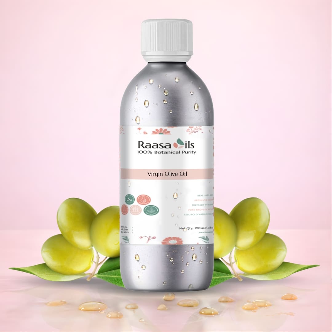 Bottle of Raasa Oils Virgin Olive Oil with olive leaves on a pink background