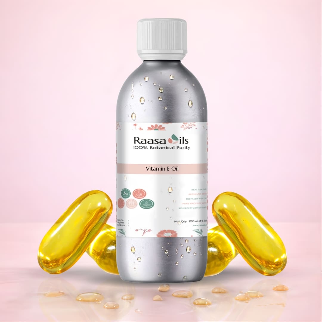 Raasa Oils Vitamin E Oil bottle with yellow capsules on a pink background