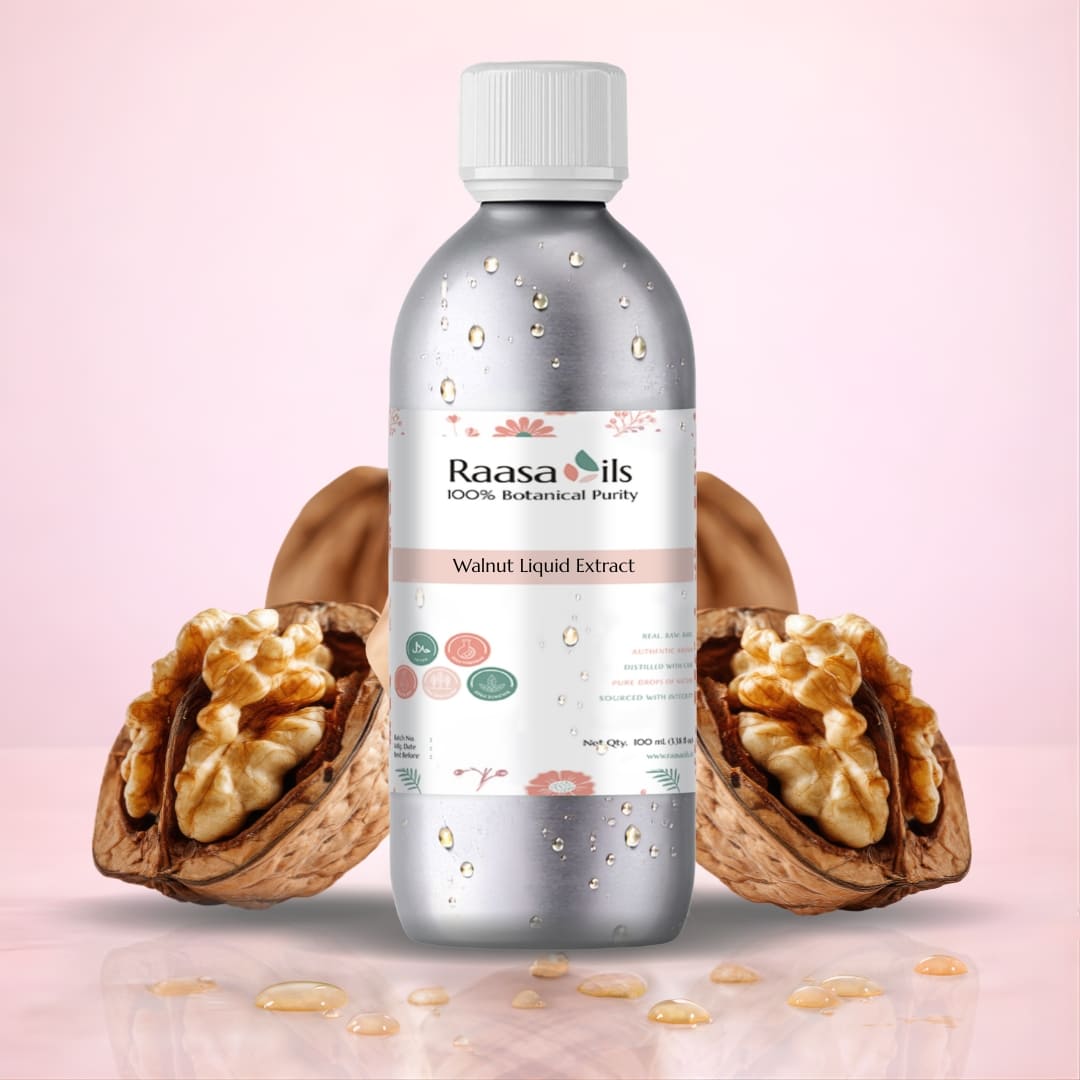 Bottle of Raasa Oils Walnut Liquid Extract with two walnuts on a pink background