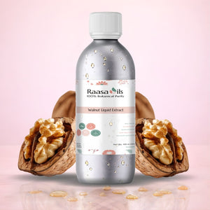 Bottle of Raasa Oils Walnut Liquid Extract with two walnuts on a pink background