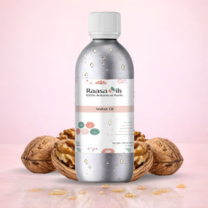 Bottle of Raasa Oils walnut oil with walnuts on a pink background