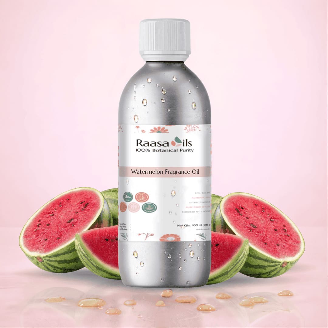 Bottle of Raasa Oils watermelon fragrance oil with watermelons on a pink background