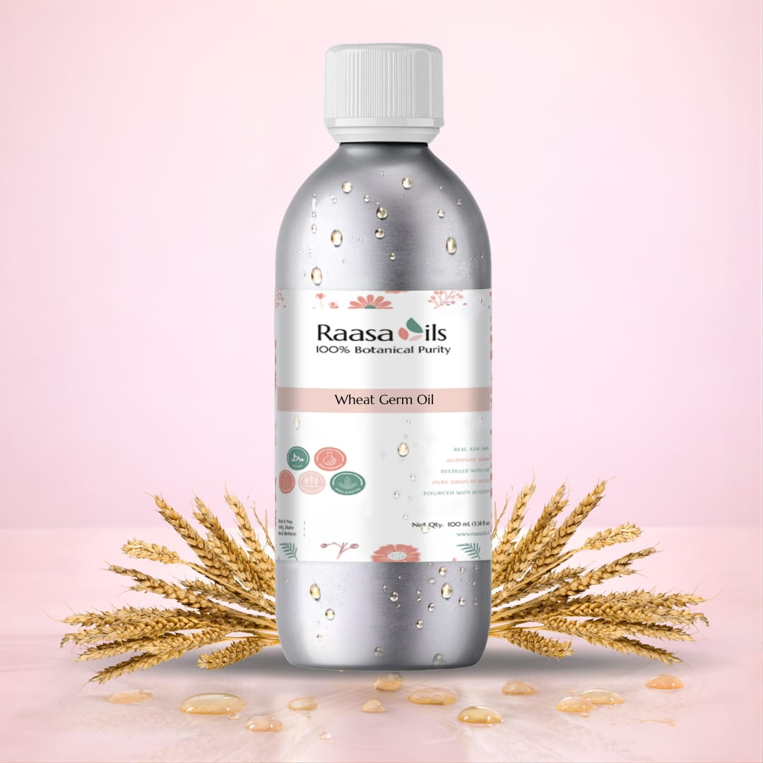 Bottle of Raasa Oils wheat germ oil with wheat stalks on a pink background