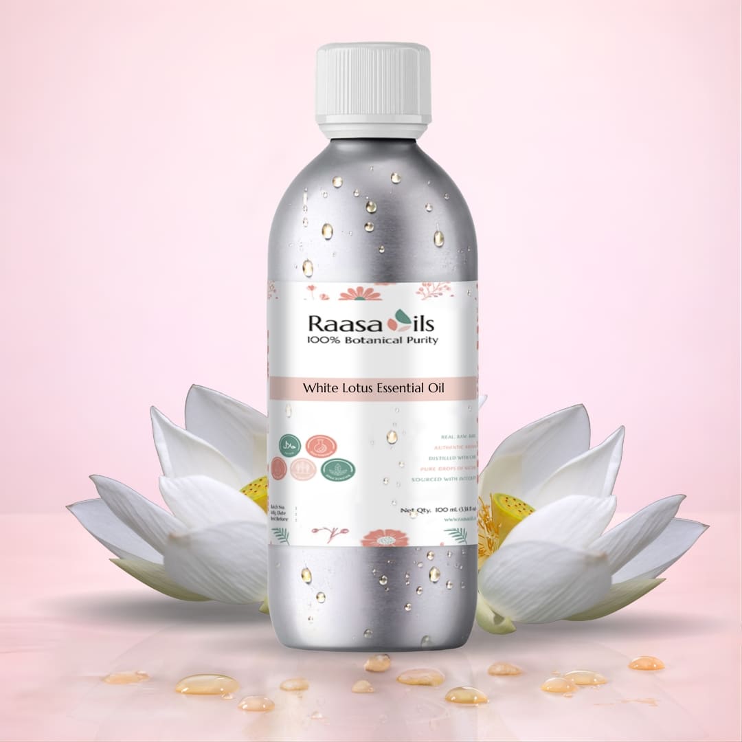 Raasa Oils White Lotus Essential Oil bottle with white lotus flowers on a pink background