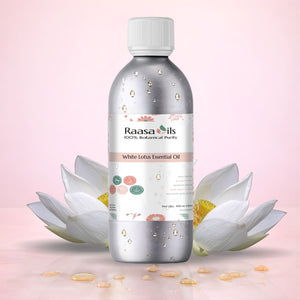 Raasa Oils White Lotus Essential Oil bottle with white lotus flowers on a pink background