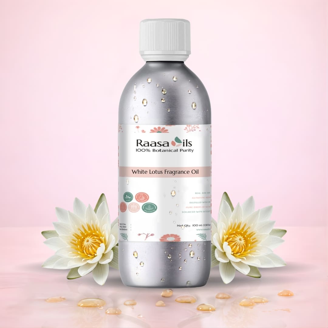 Raasa Oils White Lotus Fragrance Oil bottle with water lilies on a pink background