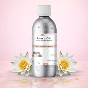Raasa Oils White Lotus Fragrance Oil bottle with water lilies on a pink background