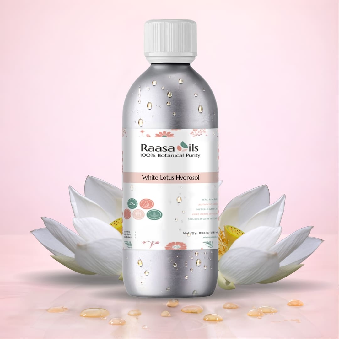 Bottle of Raasa Oils White Lotus Hydrosol with white lotus flowers on a pink background