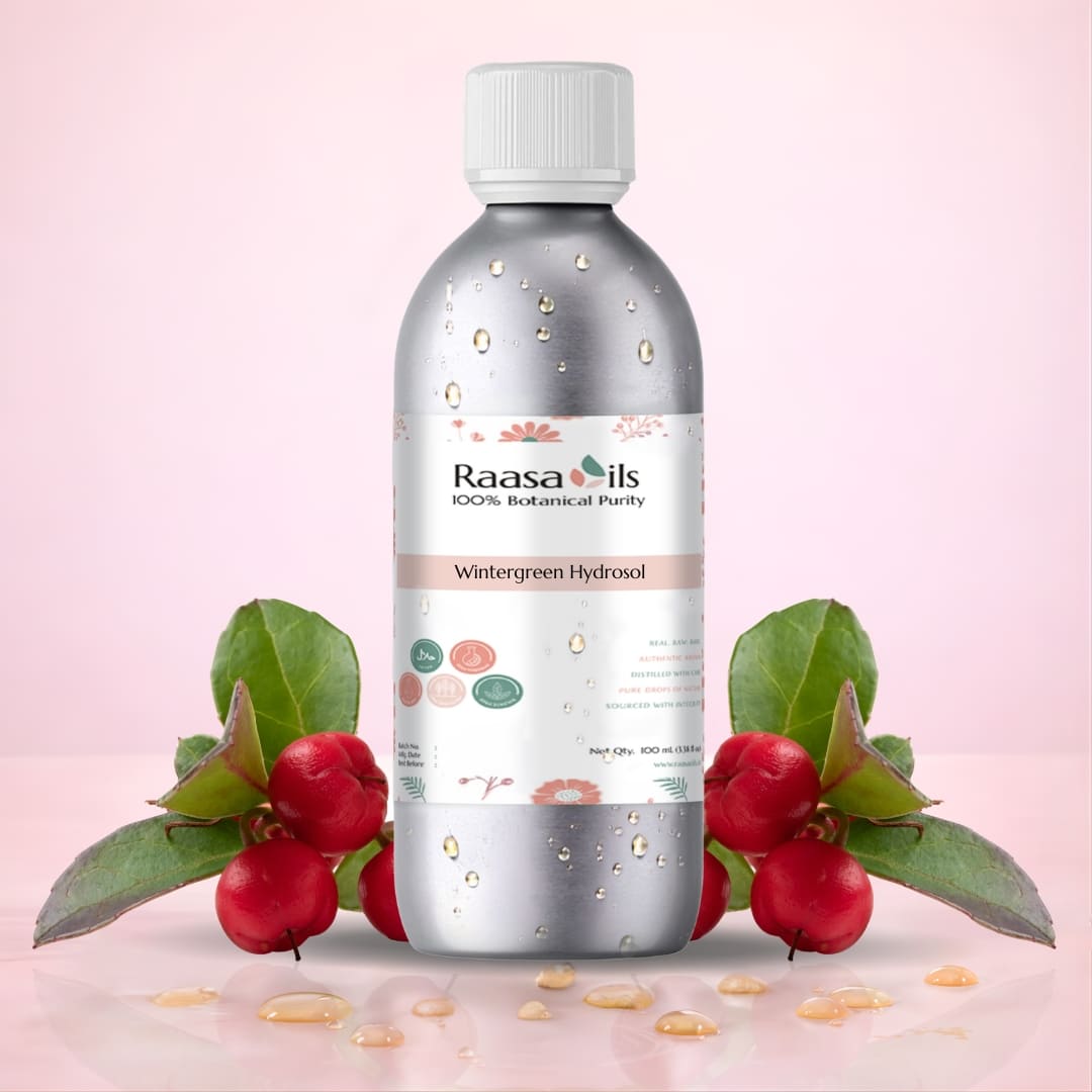 Bottle of Raasa Oils with watermelon leaves and seeds on a pink background