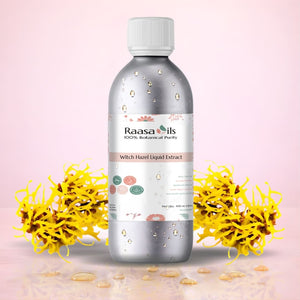 Bottle of Raasa Oils Witch Hazel Liquid Extract with yellow flowers on a pink background