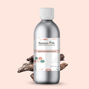 Bottle of Raasa Oils Agarwood Liquid Extract with a light pink background