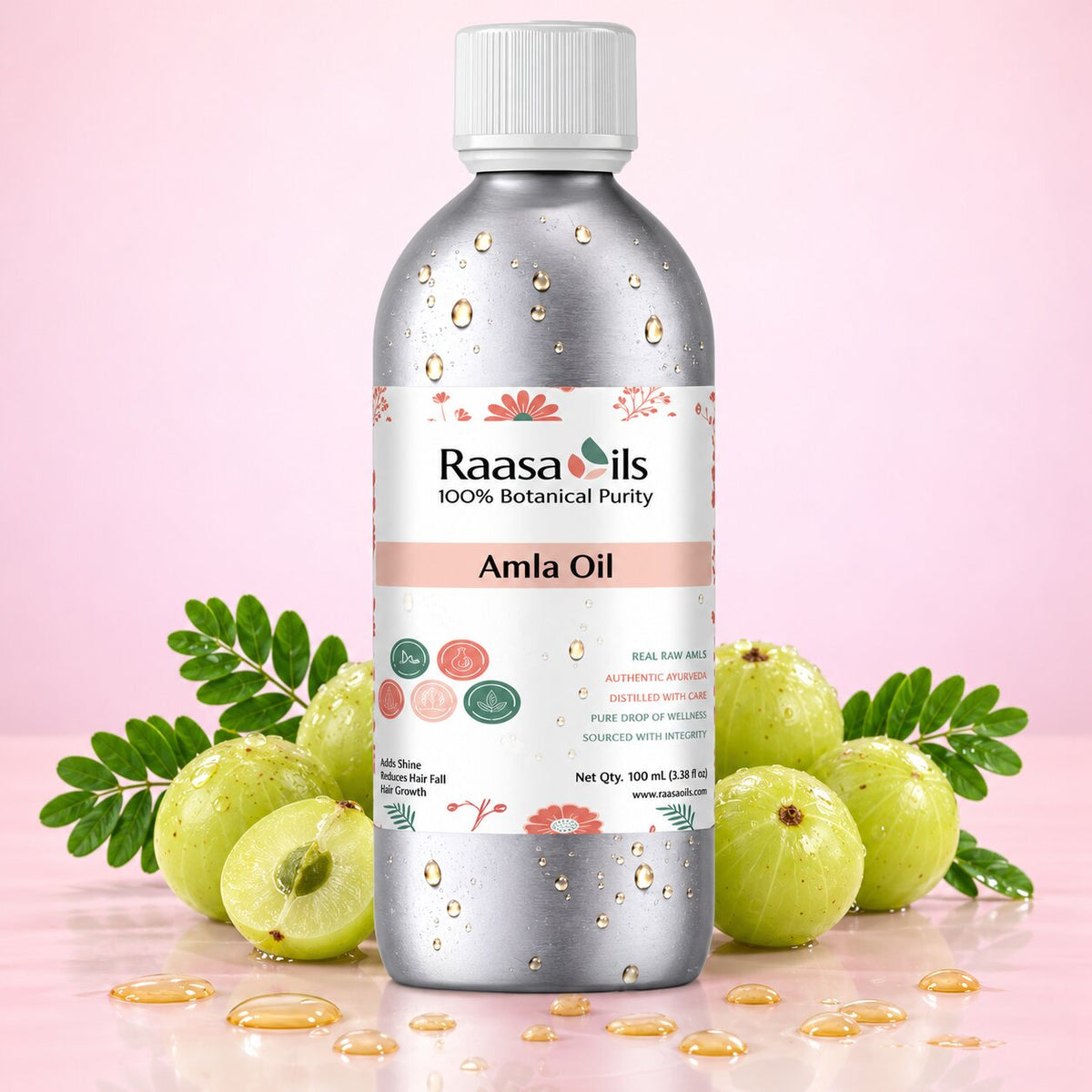 A bottle of Raasa oils Amla Oil centered on a pink background, surrounded by whole and halved green amla fruits with leaves and scattered golden oil droplets.