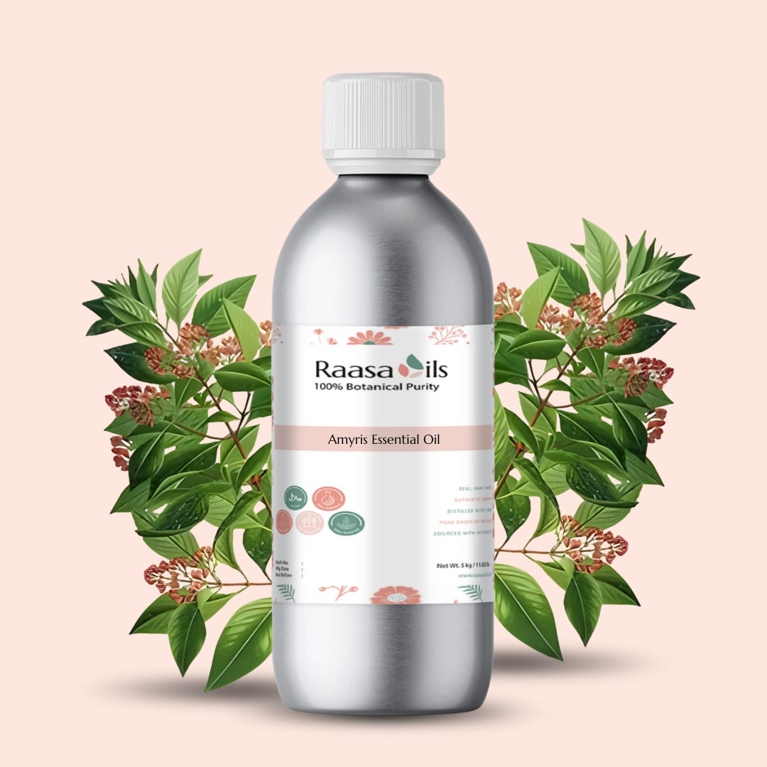 Silver bottle of Raasa Oils Amyris Essential Oil with green leaves on a beige background