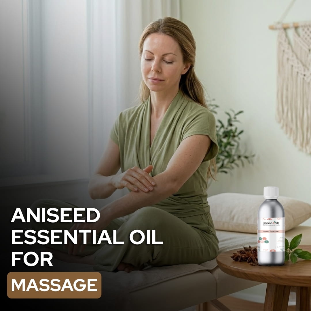 Woman in a green dress sitting on a chair with aniseed essential oil bottle and leaves on a table.