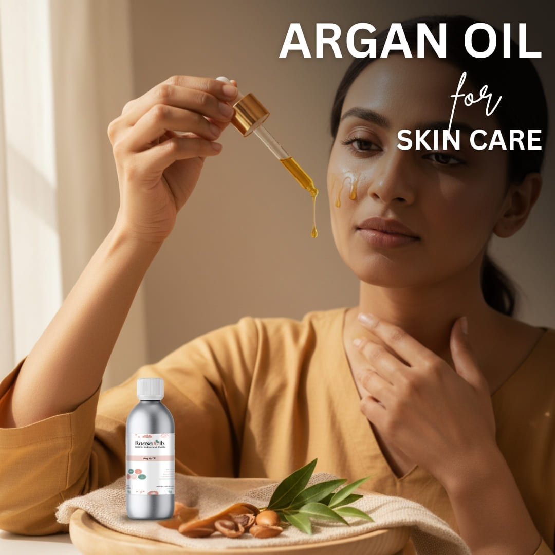 Woman applying argan oil to her face with a dropper, surrounded by argan nuts and leaves on a wooden tray.