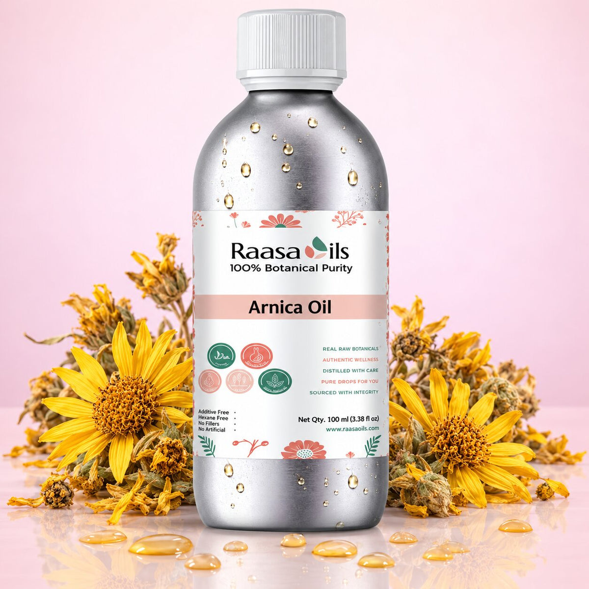 A bottle of Raasa Oils Arnica Oil centered on a pink background, surrounded by yellow Arnica flowers and scattered golden oil droplets. The bottle is metallic silver with a white cap and a white label featuring pink and green accents.