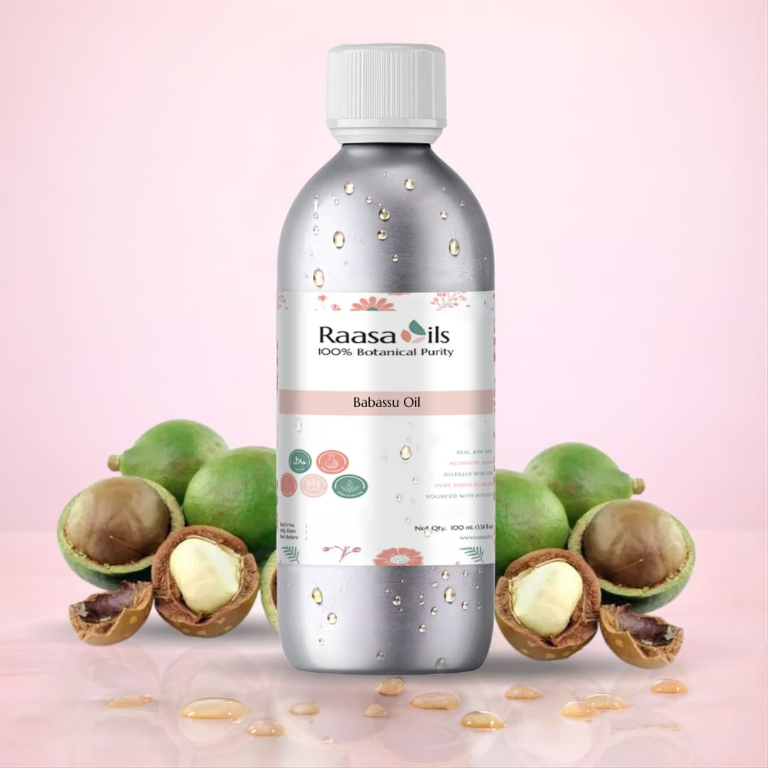 Bottle of Raasa Oils Babassu Oil with green fruits and seeds on a pink background