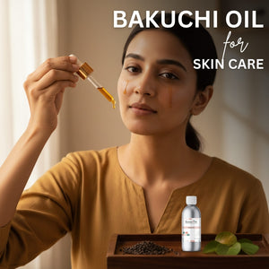 Woman holding a dropper with Bakuchi oil over her face, with a bottle and seeds on a tray below.
