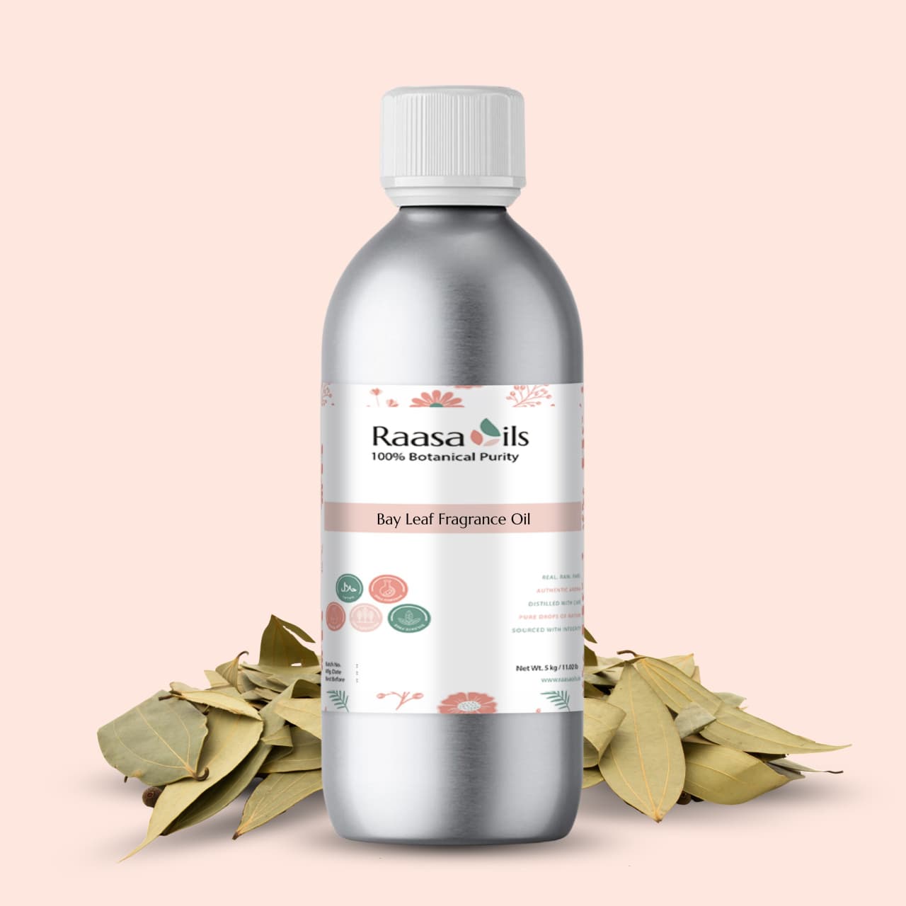 Bottle of Raasa Oils Bay Leaf Fragrance Oil with bay leaves on a light pink background