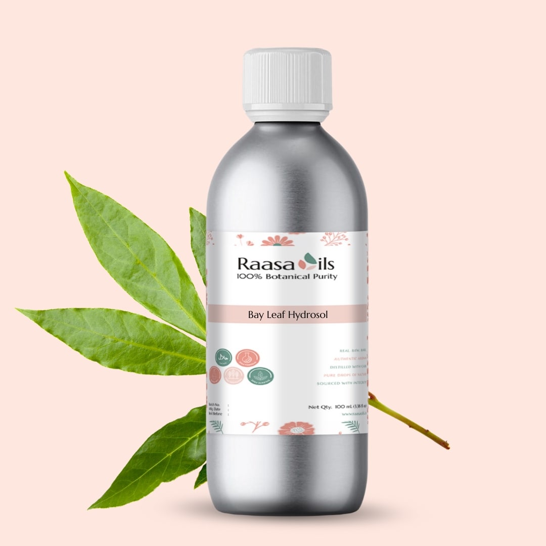 Bottle of Raasa Oils Bay Leaf Hydrool with leaves on a beige background