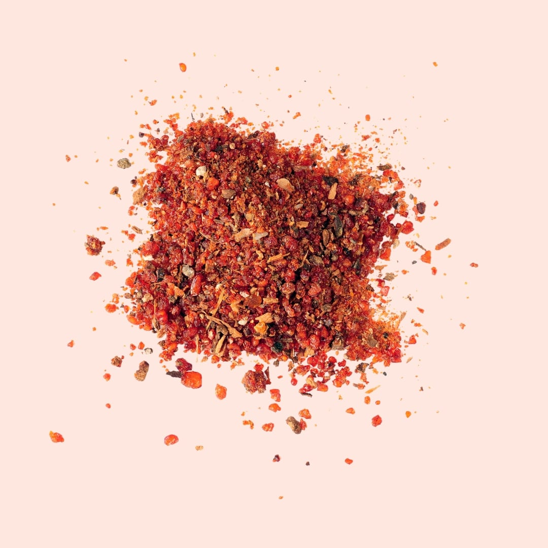 Spice blend on a light pink background