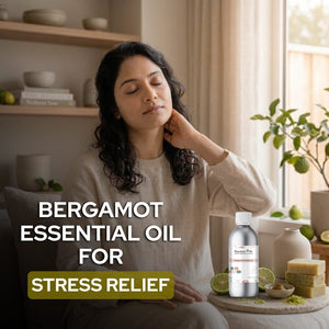 Woman relaxing with bergamot essential oil for stress relief in a home setting.