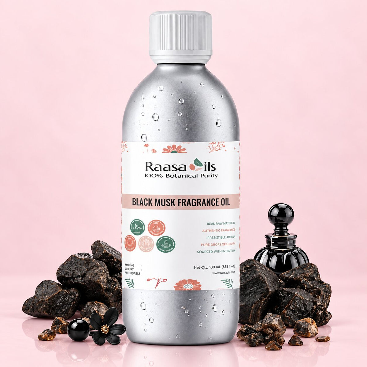 A bottle of Raasa Oils Black Musk Fragrance Oil, 100% Botanical Purity, shown with black musk flowers and raw black musk roots on a light pink background.