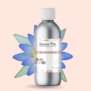 Bottle of Raasa Oils Blue Lotus Essential Oil with a blue lotus flower on a light pink background