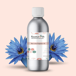 Bottle of Raasa Oils Blue Lotus Fragrance Oil with blue lotus flowers on a beige background