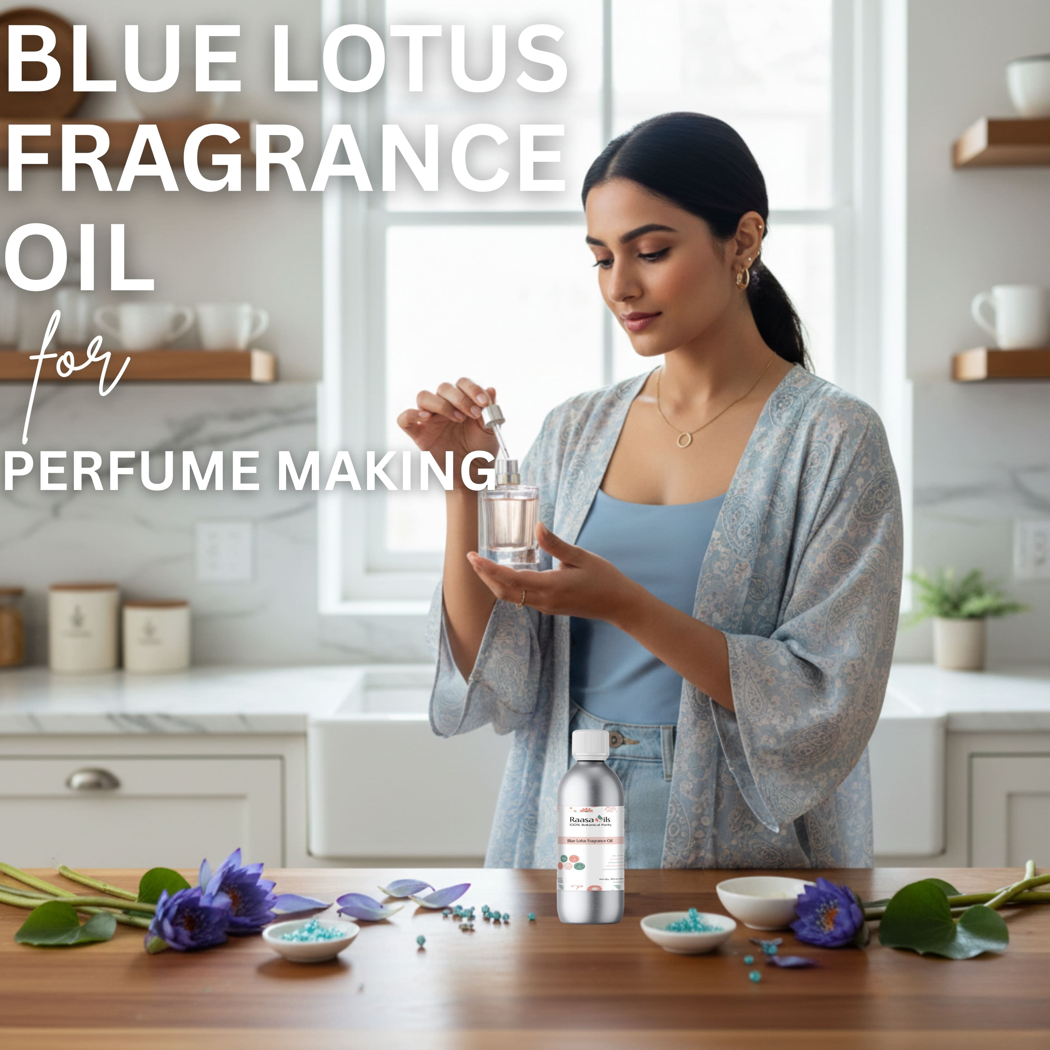 Woman holding a bottle of Blue Lotus fragrance oil in a kitchen setting with flowers and containers on the table.