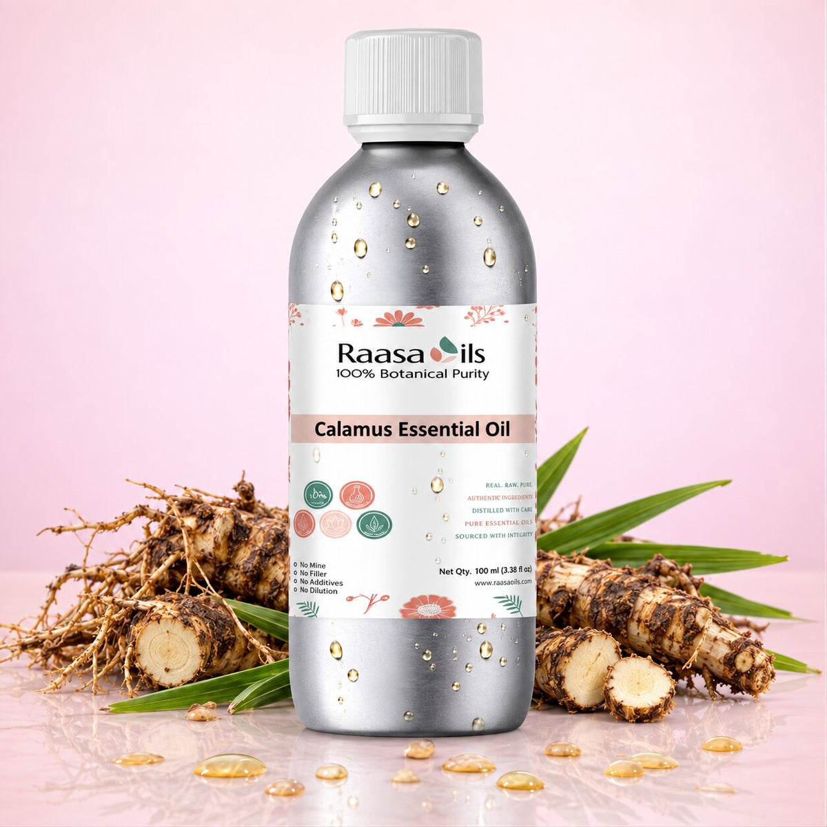 A bottle of Raasa oils Calamus Essential Oil centered on a soft pink background, flanked by green rosemary sprigs and small amber droplets on a reflective surface.