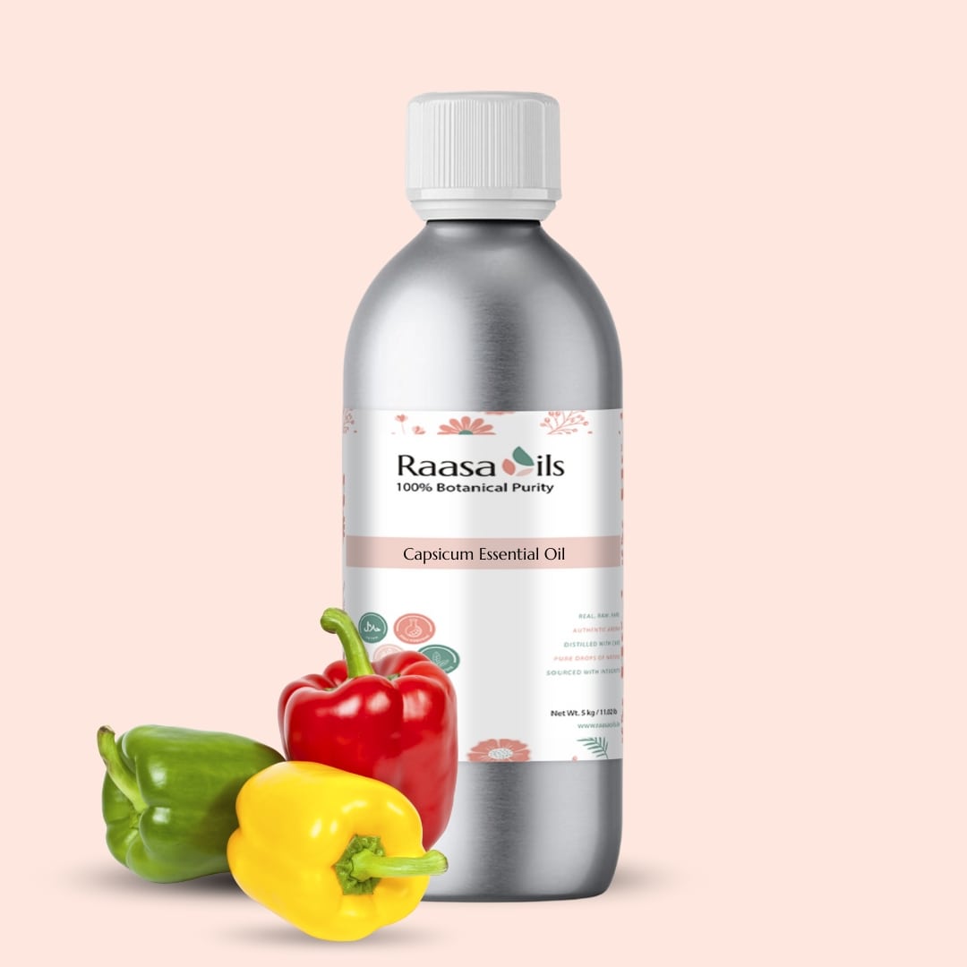 Bottle of Raasa Oils Capsicum Essential Oil with colorful peppers on a beige background