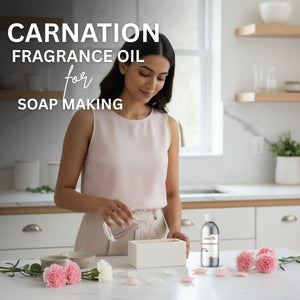 Woman in a kitchen preparing soap with Carnation Fragrance Oil, surrounded by flowers and a bottle of Carnation product.
