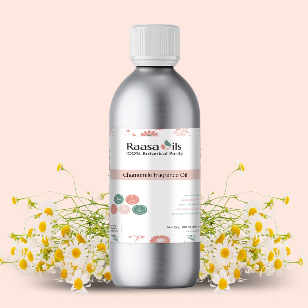 Bottle of Raasa Oils Chamomile Fragrance Oil with chamomile flowers on a light pink background