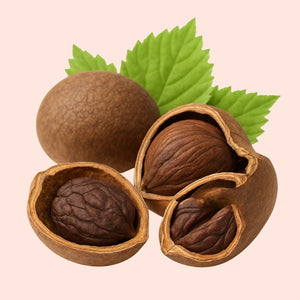 Walnuts with green leaves on a beige background