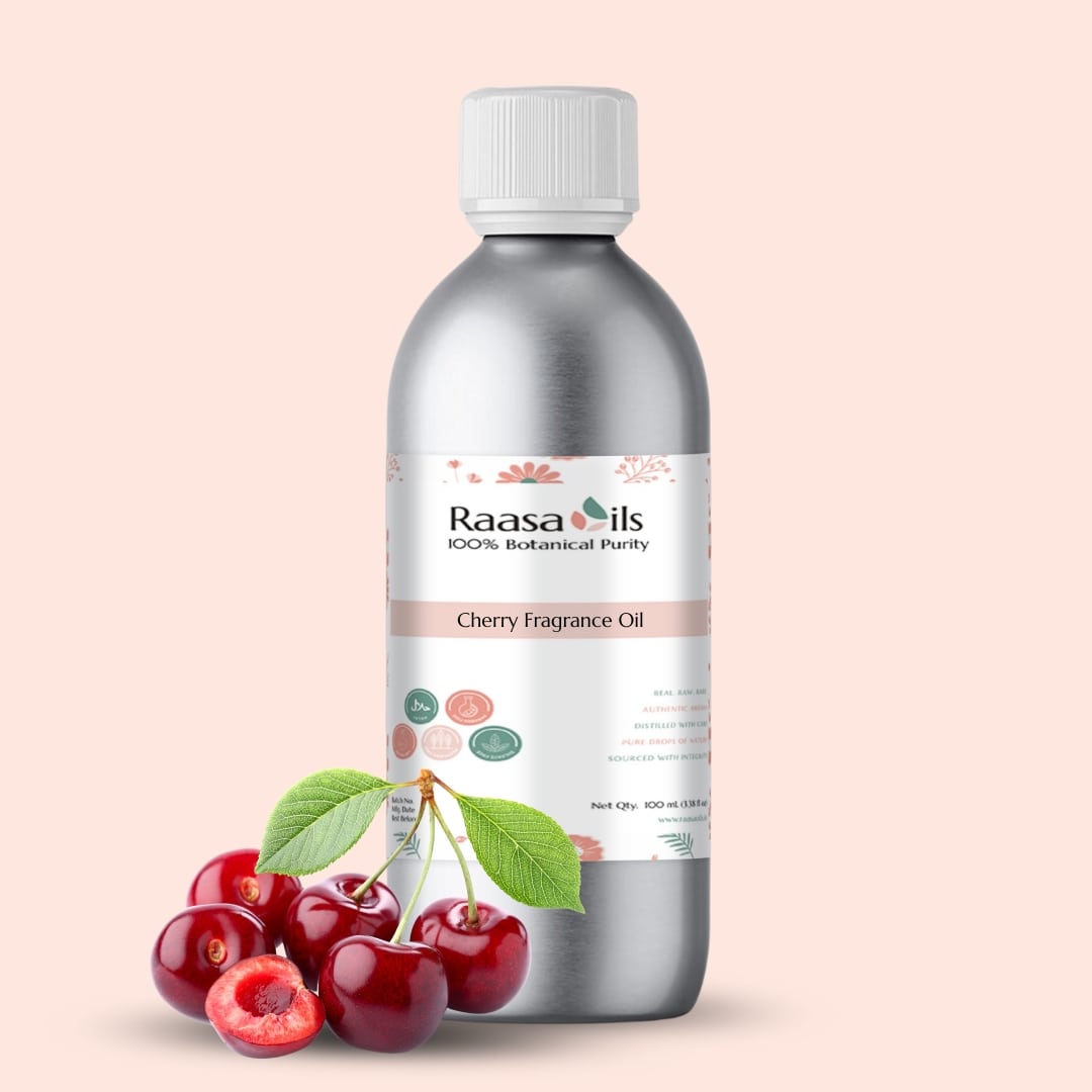 Bottle of Raasa Oils Cherry Fragrance Oil with cherries on a beige background