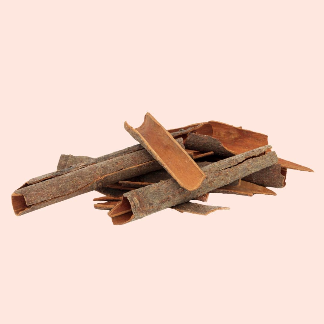 Cinnamon sticks on a beige background