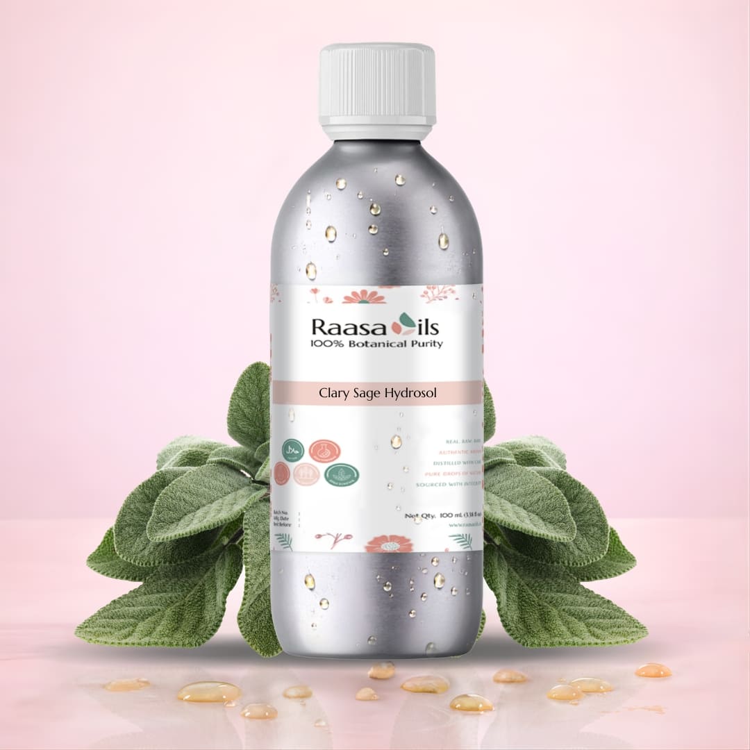Bottle of Raasa Oils Clary Sage Hydrosol with green leaves on a pink background