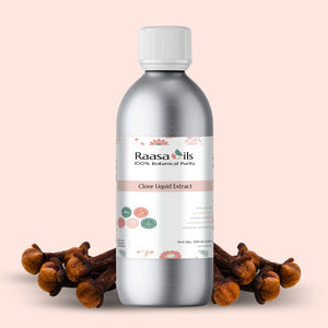Bottle of Raasa Oils Clove Liquid Extract with cloves on a beige background