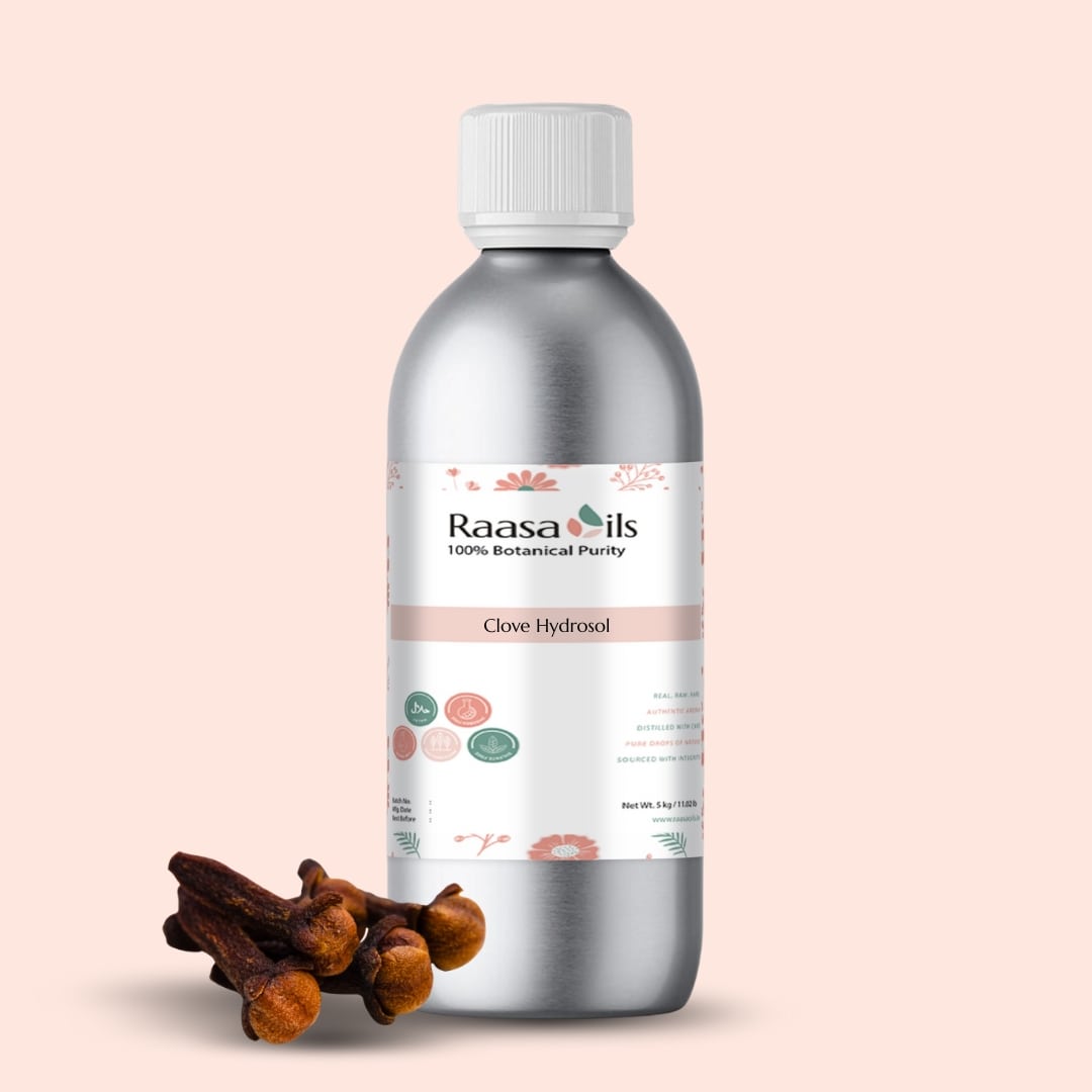 Bottle of Raasa Oils Clove Hydrosol with cloves on a beige background
